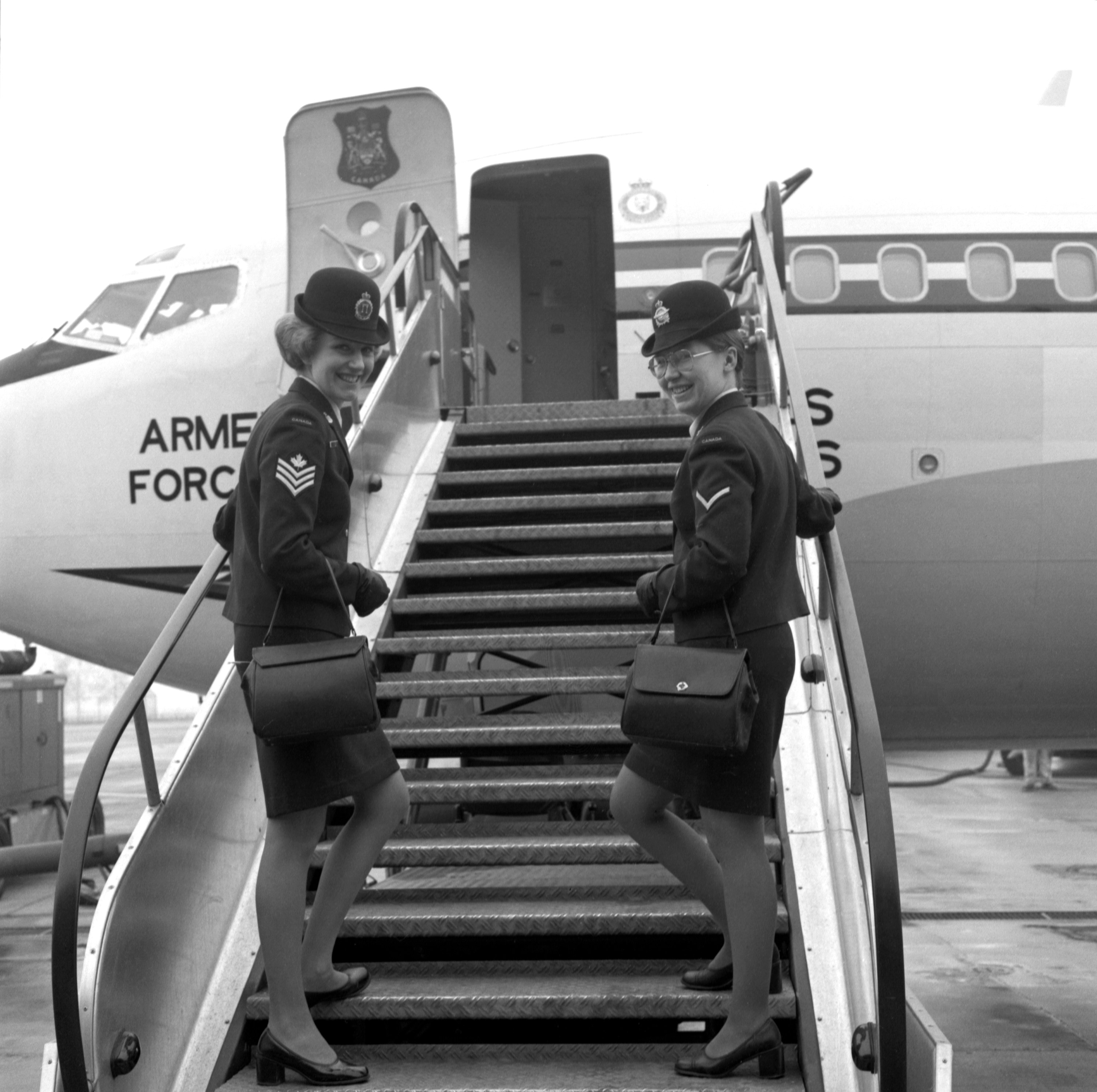 Our Canadian Armed Forces stewardesses boarding a Canadian Armed Forces Boeing 707 (CC-137) at Canadian Forces Base Lahr in West Germany,to prepare the aircraft for us passengers for the flight to Canadian Forces base Ottawa in Ontario, Canada.
