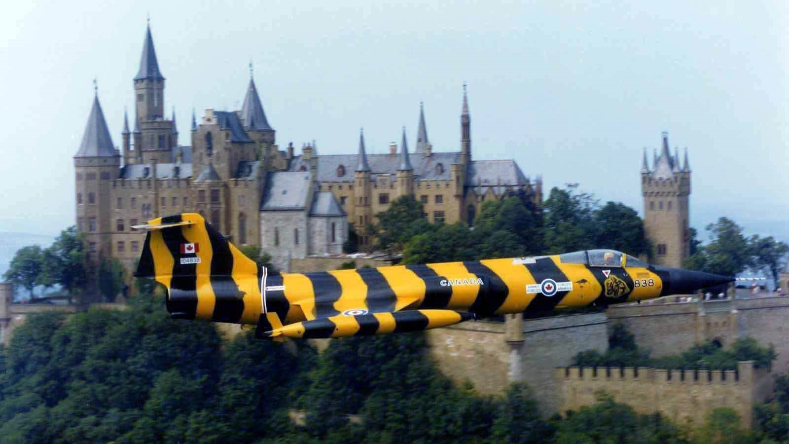 Canadian Armed Forces CF-104 Tigerbird flies by Schloss Hohenzollern castle in West Germany